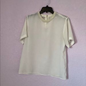 White Blouse with Peal detail at the neckline